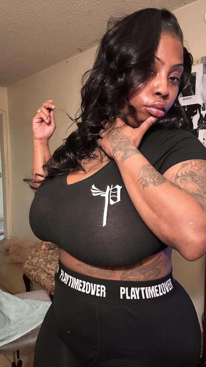 Model wearing a black Playtimezover top and leggings set